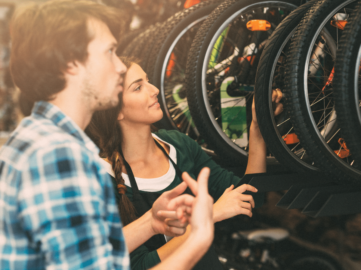 An employee and a customer in a bike shop